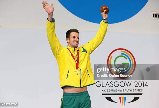 Gold medallist James Magnussen of Australia celebrates during the medal ceremony for the Men's 100m Freestyle Final at Tollcross International...