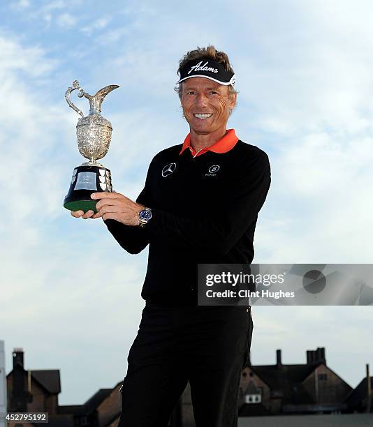 Bernhard Langer of Germany holds the Senior Open Championship trophy after his victory during the fourth round of the Senior Open Championship at...