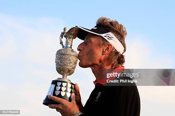 Bernhard Langer of Germany poses with the trophy after the final round of the Senior Open Championship played at Royal Porthcawl Golf Club on July...