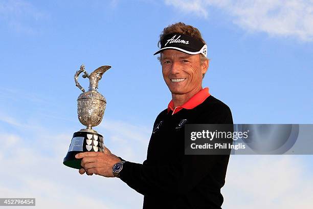 Bernhard Langer of Germany poses with the trophy after the final round of the Senior Open Championship played at Royal Porthcawl Golf Club on July...