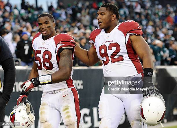 Daryl Washington of the Arizona Cardinals and Dan Williams walk off of the field following the game against the Philadelphia Eagles at Lincoln...