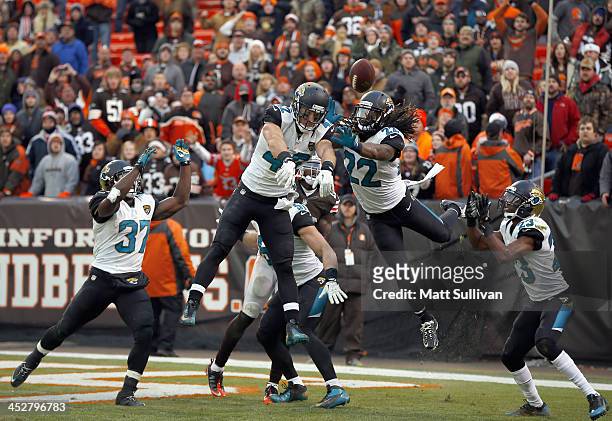 Defenders Johnathan Cyprien, Chris Prosinski, Winston Guy and Alan Ball of the Jacksonville Jaguars break up a hail mary pass play to the endzone...