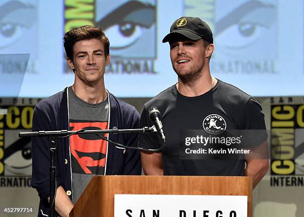 Actors Grant Gustin and Stephen Amell attend Warner Bros. Television & DC Entertainment world premiere presentation during Comic-Con International...