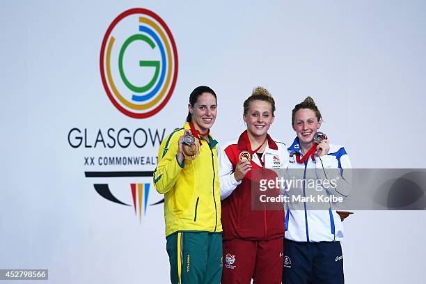 Gold medallist Siobhan O'Connor of England poses with silver medallist Alicia Coutts of Australia and bronze medallist Hannah Miley of Scotland...