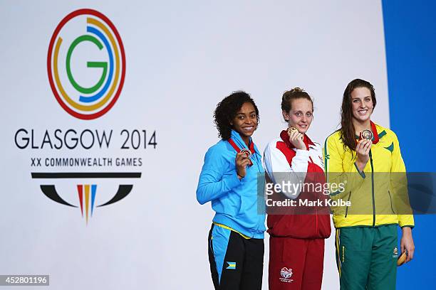 Gold medallist Francesca Halsall of England poses with silver medallist Arianna Vanderpool Wallace of Bahamas and bronze medallist Brittany Elmslie...