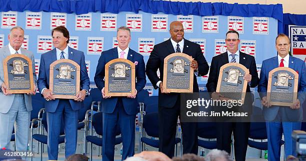 Inductees, from left, Bobby Cox, Tony La Russa, Tom Glavine, Frank Thomas, Greg Maddux and Joe Torre pose with their plaques at Clark Sports Center...