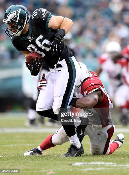 Zach Ertz of the Philadelphia Eagles tries to get a few extra yards as Daryl Washington of the Arizona Cardinals makes the tackle on December 1, 2013...