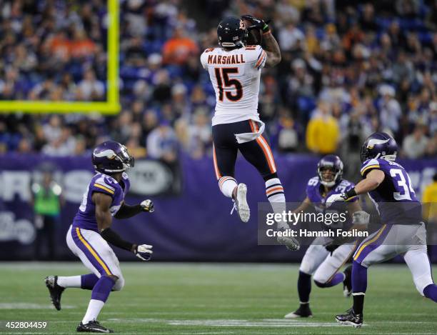 Brandon Marshall of the Chicago Bears catches the ball as Xavier Rhodes, Robert Blanton and Andrew Sendejo of the Minnesota Vikings looks on during...