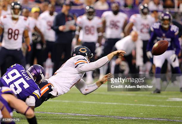 Sharrif Floyd of the Minnesota Vikings forces the fumble of Josh McCown of the Chicago Bears for a Vikings recovery on December 1, 2013 at Mall of...