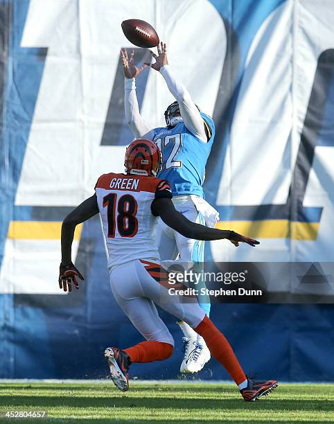 Safety Eric Weddle of the San Diego Chargers intercepts a pass in the second quarter intended for widee receiver A.J. Green of the Cincinnati Bengals...