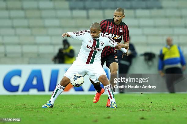 Cleberson of Atletico-PR competes for the ball with Valter of Fluminense during the match between Atletico-PR and Fluminense for the Brazilian Series...