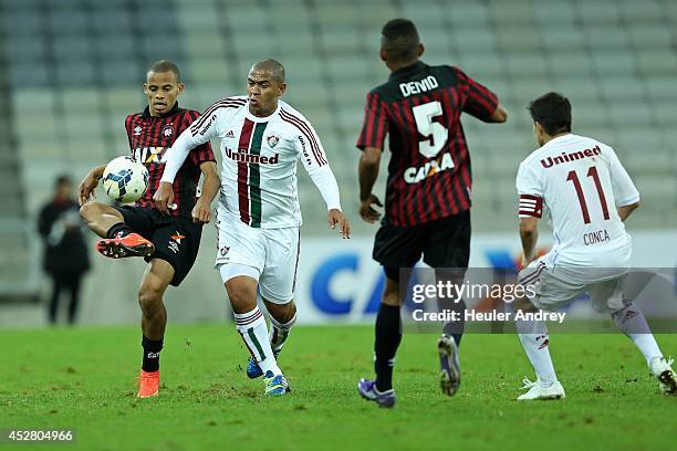 Cleberson of Atletico-PR competes for the ball with Valter of Fluminense during the match between Atletico-PR and Fluminense for the Brazilian Series...