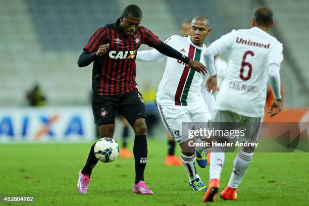 Marcelo of Atletico-PR competes for the ball with Valter of Fluminense during the match between Atletico-PR and Fluminense for the Brazilian Series A...