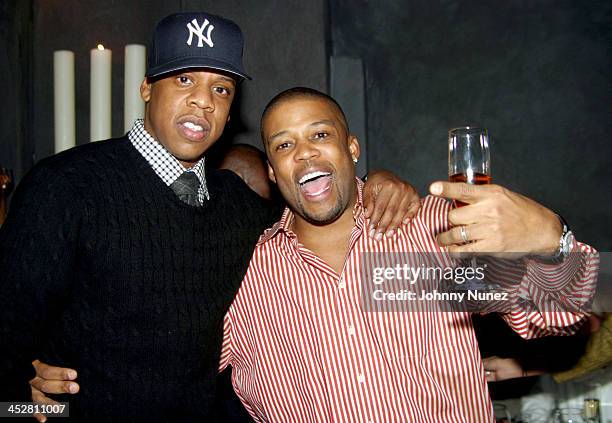 Jay-Z and Chuck Bones during Sean P. Diddy Combs' Surprise 35th Birthday Party at Figa in New York City, New York, United States.