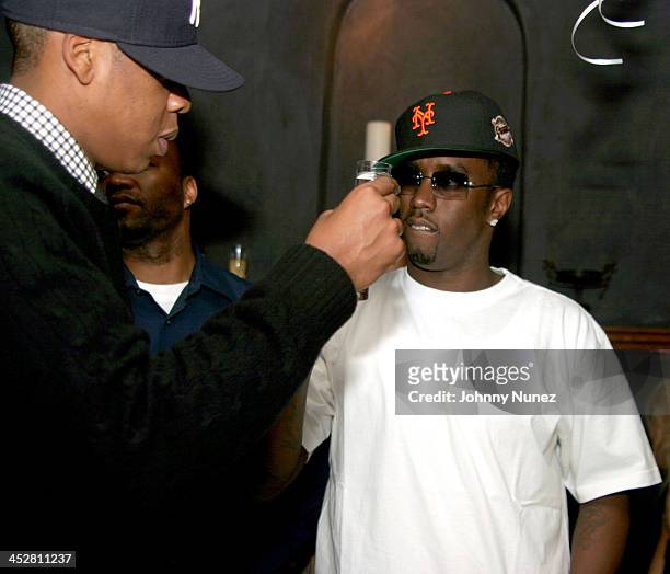 Jay-Z and Sean P.Diddy Combs during Sean P. Diddy Combs' Surprise 35th Birthday Party at Figa in New York City, New York, United States.