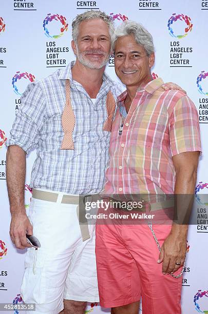 Actor Gerald McCullouch and Olympian Greg Louganis arrive at the GLEH/Los Angeles LGBT Center's Garden Party on July 27, 2014 in Los Angeles,...