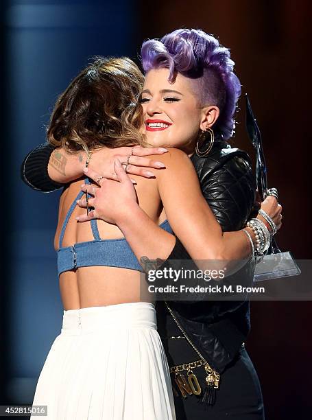 The winner of Young Hollywood Trendsetter Award Actress Vanessa Hudgens and host Kelly Osbourne onstage at the 2014 Young Hollywood Awards brought to...