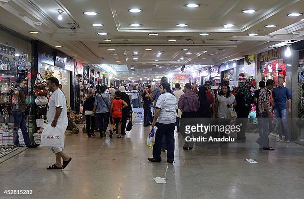 Jordanian muslims do their shopping in preparation for Eid el-Fitr, when traditionally Muslims buy clothes for the celebrations which mark the end of...