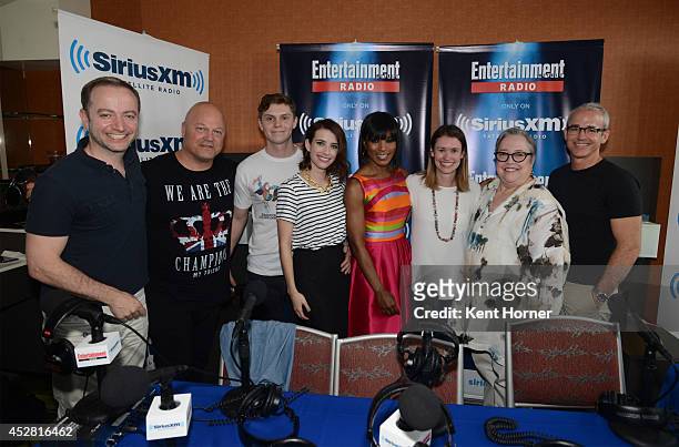 Michael Chiklis, Evan Peters, Emma Roberts, Angela Bassett and Kathy Bates pose with radio hosts Mario Correa and Jess Cagle after being interviewed...
