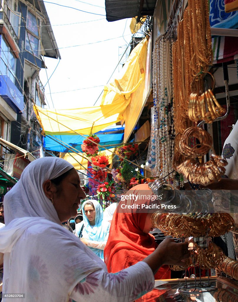 The women look for bracelets before the Eid in Lal Chowl.