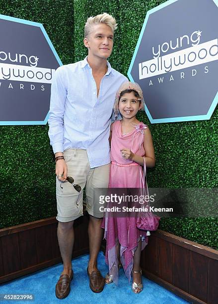 Singer/songwriter Cody Simpson and Make a Wish recipient Wish Child Grace attend the 2014 Young Hollywood Awards brought to you by Samsung Galaxy at...