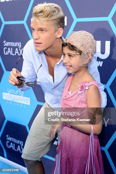 Singer/songwriter Cody Simpson and Make a Wish recipient Wish Child Grace attend the 2014 Young Hollywood Awards brought to you by Samsung Galaxy at...