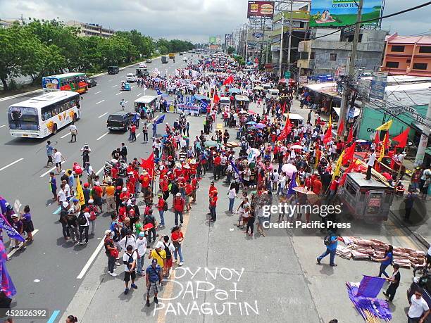 On the fifth State of the Nation Address of Pres. Benigno Noynoy Aquino Jr., thousands of militant groups converge at Commonwealth Avenue in Quezon...