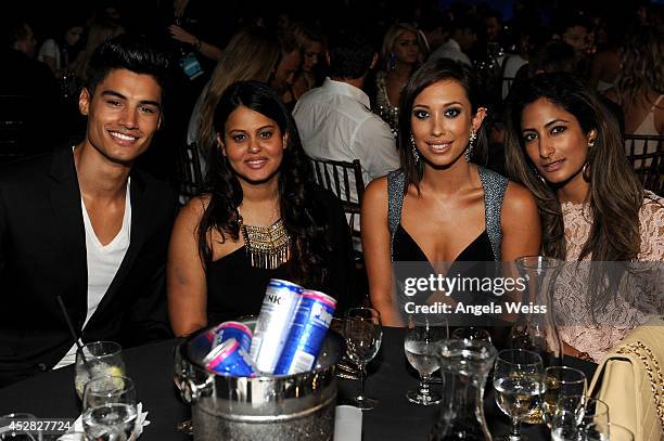 Actor Siva Kaneswaran and dancer Cheryl Burke in the audience at the 2014 Young Hollywood Awards brought to you by Samsung Galaxy at The Wiltern on...