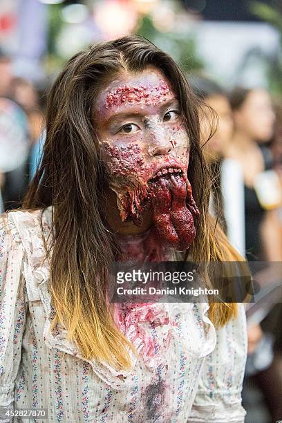 Costumed fans attend Comic-Con International at San Diego Convention Center on July 27, 2014 in San Diego, California.