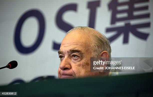 Sheldon Lavin, CEO of the OSI Group, reacts as he attends a press conference over the recent expired meat scandal in Shanghai on July 28, 2014....
