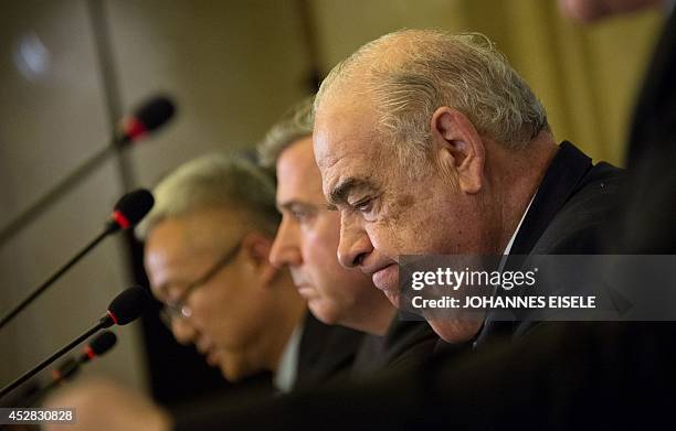 Sheldon Lavin , CEO of the OSI Group, reacts as he attends a press conference over the recent expired meat scandal in Shanghai on July 28, 2014....