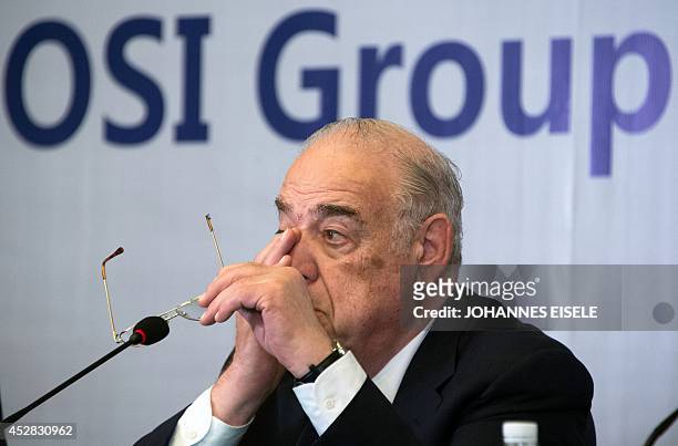 Sheldon Lavin, CEO of the OSI Group, gestures as he attends a press conference over the recent expired meat scandal in Shanghai on July 28, 2014....