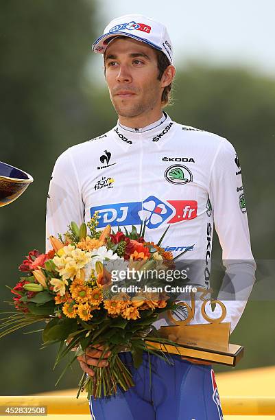 Thibaut Pinot of France and FDJ.fr receives the best young rider's white jersey on the podium after the twenty one and last stage of the 2014 Tour de...