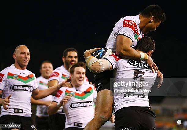 The Rabbitohs celebrate a try by Bryson Goodwin during the round 20 NRL match between the Canberra Raiders and the South Sydney Rabbitohs at GIO...