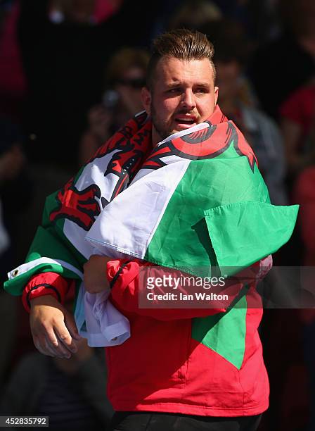 Aled Davies of Wales celebrates as he wins silver in the Men's F42/44 Discus final at Hampden Park Stadium during day five of the Glasgow 2014...