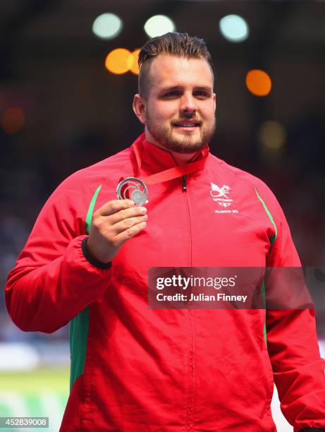 Silver medallist Aled Davies of Wales on the podium during the medal ceremony for the Men's F42/44 Discus at Hampden Park during day five of the...