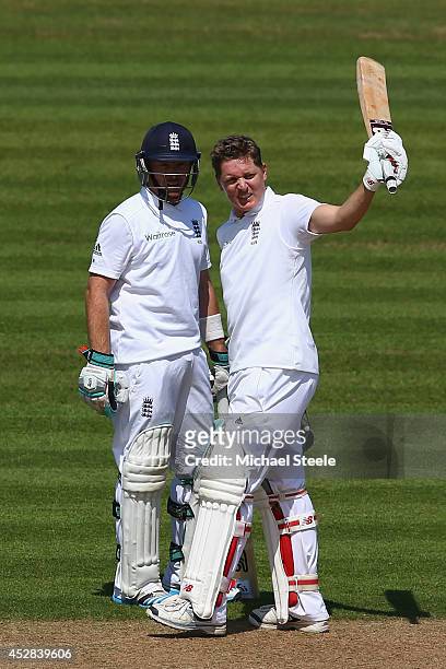 Gary Ballance of England raises his bat after reaching his 150 alongside Ian Bell during day two of the 3rd Investec Test match between England and...