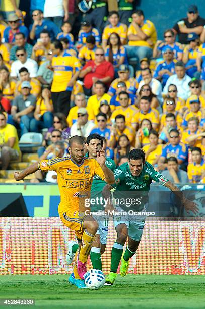 Emanuel Villa of Tigres fights for the ball with Rafael Marquez of Leon during a match between Tigres UANL and Leon as part of 2nd round Apertura...