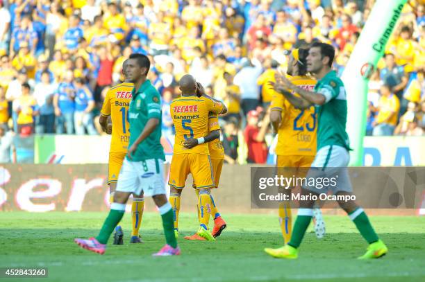 Hernan Burbano of Tigres celebrates with teammates during a match between Tigres UANL and Leon as part of 2nd round Apertura 2014 Liga MX at...