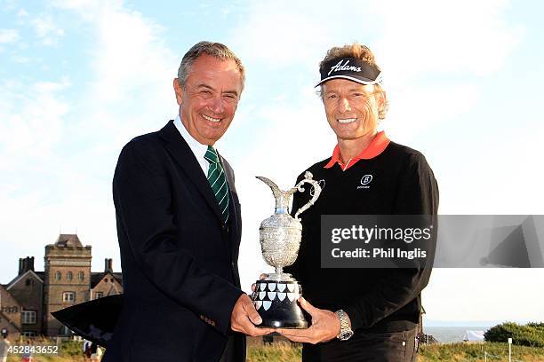 Bernhard Langer of Germany and Jean-Noel Bioul of Rolex pose with the trophy after the final round of the Senior Open Championship played at Royal...