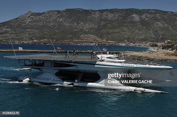 The world's largest solar-powered boat, "MS Turanor PlanetSolar" sails through the Corinth Canal near the town of Corinth on July 28, 2014. The boat...