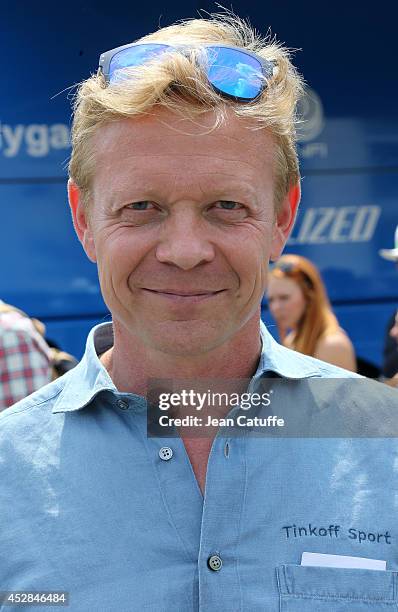 Sports director of Tinkoff-Saxo Philippe Mauduit looks on prior to the twenty one and last stage of the 2014 Tour de France, a 134 km individual time...