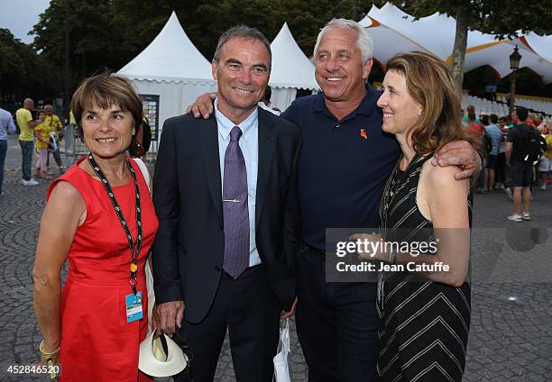 Five time winner of the Tour de France Bernard Hinault and his wife Martin Hinault pose with three time winner of the Tour Greg LeMond of USA and his...