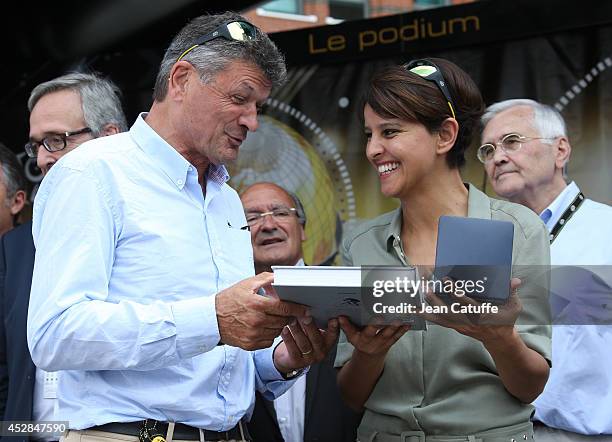 Two time winner of the Tour de France Bernard Thevenet offers a book about the Tour to French Minister of Women's Rights and Sports Najat...