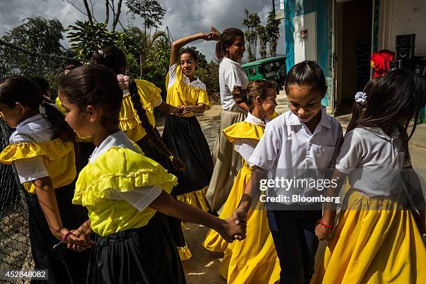 School children perform a traditional dance at the Culebrilla elementary school in Culebrilla, Venezuela, about 20 kilometers outside of Caracas, on...