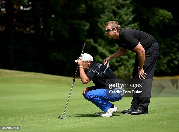 Tim Butler and Nigel Cadby-Hart of Newbury Golf Centre line up a putt during the Golfbreaks.com PGA Fourball Championship - Southern Regional...