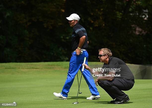 Tim Butler and Nigel Cadby-Hart of Newbury Golf Centre line up a putt during the Golfbreaks.com PGA Fourball Championship - Southern Regional...