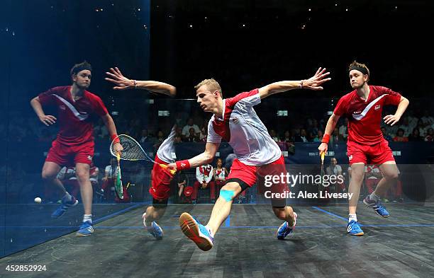 Nick Matthew of England plays a shot against James Willstrop of England during the Men's Singles Gold medal Final between Nick Matthew of England and...