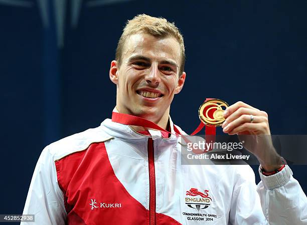 Nick Matthew of England poses with his gold medal after victory over James Willstrop of England in the Men's Singles Gold medal Final between Nick...