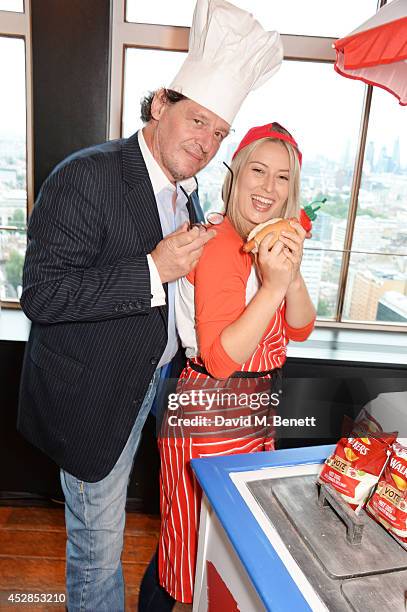 Chef Marco Pierre White poses with a finalist at the 'Walkers 'Do Us A Flavour' finalists launch at Paramount, Centre Point on July 28, 2014 in...